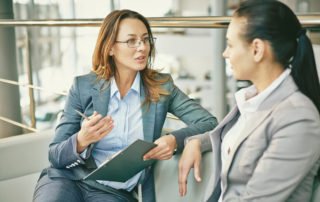 HR managers asking questions of a new hire